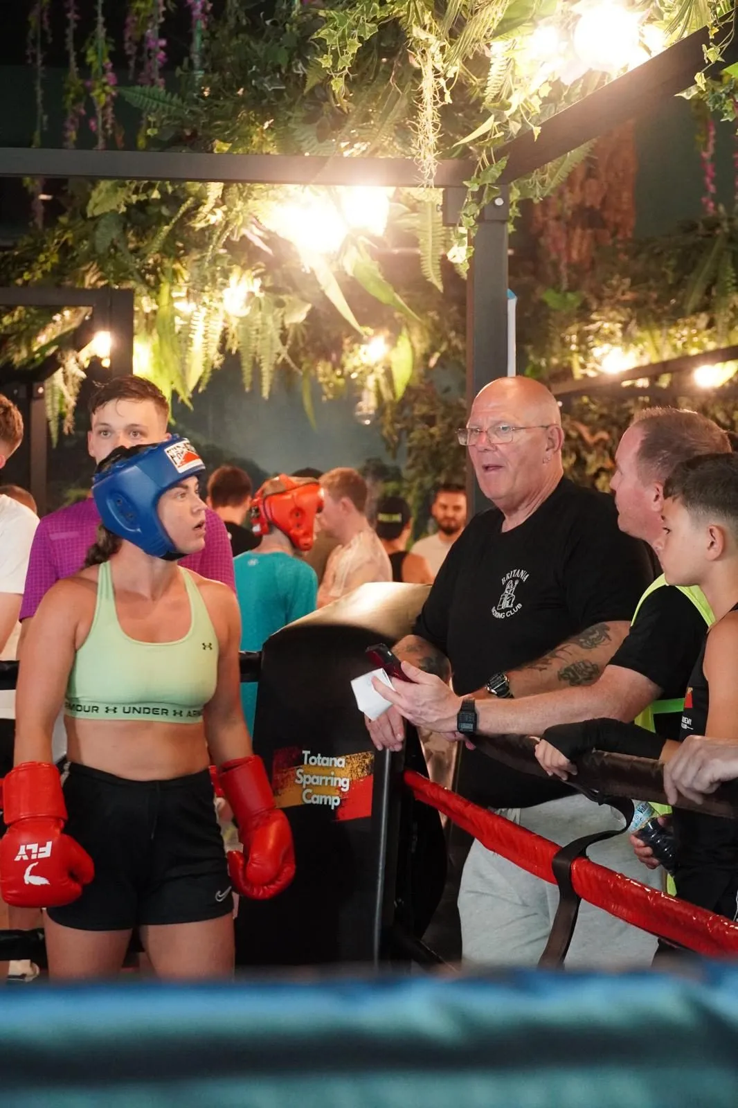 Coach and boxer between rounds