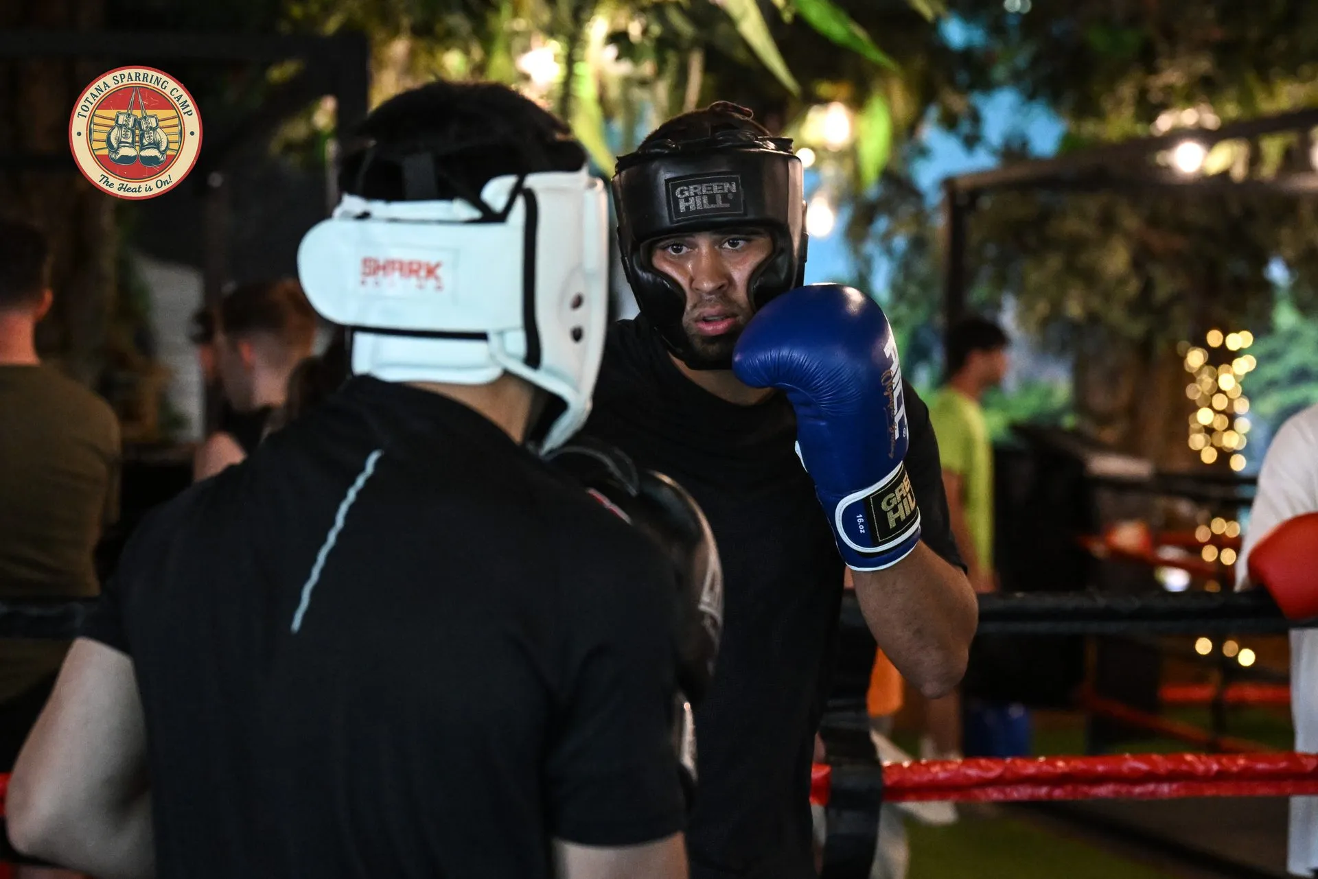Two boxers facing off during sparring at Totana Sparring Camp
